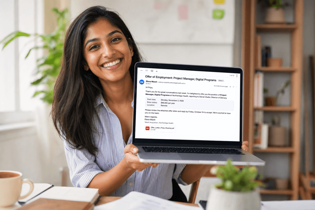 Happy professional celebrating a job offer on her laptop